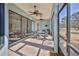 Relaxing screened lanai with ceiling fans and seating at 9694 Southern Belle Dr, Weeki Wachee, FL 34613