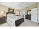 Comfortable bedroom featuring a ceiling fan, and a connecting door to the bathroom at 11637 Spindrift Loop, Hudson, FL 34667