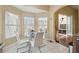 Sunny breakfast nook with seating for four and sliding glass door access at 11637 Spindrift Loop, Hudson, FL 34667