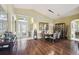 Elegant dining area with modern lighting and dark wood floors at 11637 Spindrift Loop, Hudson, FL 34667