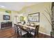 Comfortable dining space with hardwood floors, featuring a stylish table and decor at 11637 Spindrift Loop, Hudson, FL 34667