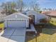 Attractive single-story home with a manicured lawn, featuring an attached two-car garage at 11637 Spindrift Loop, Hudson, FL 34667