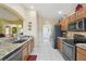 Bright kitchen with granite countertops, stainless steel appliances, and convenient layout at 11637 Spindrift Loop, Hudson, FL 34667