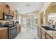 Well-appointed kitchen with stainless appliances, eat-in table, and lots of natural light at 11637 Spindrift Loop, Hudson, FL 34667