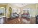 Spacious living room featuring wood floors, neutral paint, and an open layout at 11637 Spindrift Loop, Hudson, FL 34667