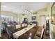 Open-concept living area with dining space, featuring hardwood floors at 11637 Spindrift Loop, Hudson, FL 34667