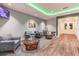 Comfortable lobby area featuring stylish seating, elegant decor, and wood-look floors for a relaxed atmosphere at 11637 Spindrift Loop, Hudson, FL 34667