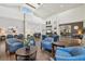 Bright lobby features comfortable blue chairs, stylish decor, wood-look flooring, and reception desk at 11637 Spindrift Loop, Hudson, FL 34667