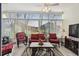 Bright sun room with tile floors, lots of windows, and outdoor access at 11637 Spindrift Loop, Hudson, FL 34667