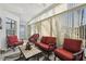 Bright sun room with tile floors, lots of windows, and comfortable seating at 11637 Spindrift Loop, Hudson, FL 34667