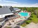 Relax by the luxurious swimming pool and spa surrounded by comfortable lounge chairs and lush landscaping at 11637 Spindrift Loop, Hudson, FL 34667