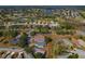 Property aerial view of a residence in a community close to a scenic golf course at 11744 Wheatfield Loop, Hudson, FL 34667