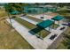 Outdoor bocce ball courts with shaded benches on concrete slabs, ideal for recreation at 11744 Wheatfield Loop, Hudson, FL 34667