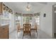Breakfast nook with a glass table and seating for four at 11744 Wheatfield Loop, Hudson, FL 34667