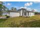 Charming single Gathering home with a manicured lawn and lovely landscaping at 11744 Wheatfield Loop, Hudson, FL 34667