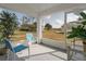 Enjoy views from the screened-in patio with comfortable seating and a serene backyard view at 11744 Wheatfield Loop, Hudson, FL 34667
