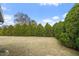 Landscaped backyard with trimmed hedges at 12417 Shafton Rd, Spring Hill, FL 34609