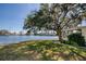 Peaceful waterfront view with a large tree at 12501 Ulmerton Rd # 19, Largo, FL 33774