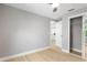 Spacious bedroom with light walls, closet, and door leading to other areas of the house at 1310 Georgia Ave, Dunedin, FL 34698