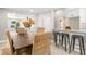 Charming dining area with a view into the kitchen, complemented by bar seating for casual gatherings at 1310 Georgia Ave, Dunedin, FL 34698