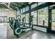 Modern fitness center featuring elliptical machines with poolside views for an enjoyable workout experience at 14855 Renaissance Ave, Odessa, FL 33556