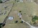 Expansive aerial view of the property showcasing the home's setting and surrounding land at 15111 Peach Bloom Rd, Brooksville, FL 34614