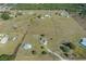 Wide-angle aerial view illustrating home, expansive lot size, and surrounding land plot at 15111 Peach Bloom Rd, Brooksville, FL 34614
