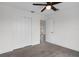 Neutral bedroom with wood look floors, closet and outdoor views at 15111 Peach Bloom Rd, Brooksville, FL 34614