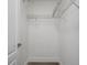 A walk-in closet provides ample storage with wire shelving and neutral walls at 15111 Peach Bloom Rd, Brooksville, FL 34614
