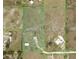 Property map showcasing lot dimensions of expansive land plot with main residence and outbuilding at 15111 Peach Bloom Rd, Brooksville, FL 34614