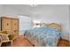 Comfortable bedroom with a king-size bed and an armoire at 1826 Rising Sun Dr, Holiday, FL 34690