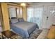 Bedroom with murphy bed, ceiling fan, and sliding door at 2164 Vista Del Sol Cir # 505, Lutz, FL 33558