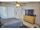 Cozy bedroom with a comfortable bed, dresser, and TV, creating a relaxing space at 2164 Vista Del Sol Cir # 505, Lutz, FL 33558