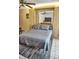 Bedroom with murphy bed, ceiling fan, and mirror at 2164 Vista Del Sol Cir # 505, Lutz, FL 33558