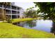 Condo building near pond with lush landscaping at 2164 Vista Del Sol Cir # 505, Lutz, FL 33558