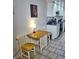Small kitchen breakfast nook with wood table and chairs at 2164 Vista Del Sol Cir # 505, Lutz, FL 33558