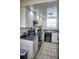 Modern kitchen with white cabinets, black appliances, and dark countertops at 2164 Vista Del Sol Cir # 505, Lutz, FL 33558