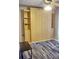 This living area features a closed murphy bed and shelves, along with a small bench at 2164 Vista Del Sol Cir # 505, Lutz, FL 33558