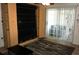 Living area featuring a murphy bed, sliding doors and a neutral-colored rug at 2164 Vista Del Sol Cir # 505, Lutz, FL 33558