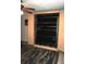 This living area features an open murphy bed, neutral rug, and ceiling fan at 2164 Vista Del Sol Cir # 505, Lutz, FL 33558