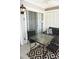 Inviting patio with outdoor seating, a patterned rug, and sliding glass doors for indoor-outdoor living at 2164 Vista Del Sol Cir # 505, Lutz, FL 33558