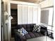 Comfortable patio seating with a grey sofa, throw pillows, and ample storage at 2164 Vista Del Sol Cir # 505, Lutz, FL 33558