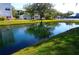 Peaceful pond with building and landscape reflection at 2164 Vista Del Sol Cir # 505, Lutz, FL 33558