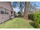 Spacious backyard with mature trees providing shade and privacy at 2263 Whisper Walk Dr, Spring Hill, FL 34606