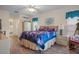 Bright bedroom with a queen-size bed and tile floors at 2263 Whisper Walk Dr, Spring Hill, FL 34606