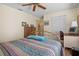 Bedroom with brass bed frame and built in desk at 2263 Whisper Walk Dr, Spring Hill, FL 34606