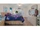 Bedroom with a queen bed, access to backyard, and tile floors at 2263 Whisper Walk Dr, Spring Hill, FL 34606