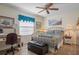 Bedroom with brass bed frame and an office area at 2263 Whisper Walk Dr, Spring Hill, FL 34606