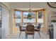 Bright breakfast nook with a three-sided window and a round table at 2263 Whisper Walk Dr, Spring Hill, FL 34606
