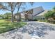 Community clubhouse with stone accents and covered entry at 2263 Whisper Walk Dr, Spring Hill, FL 34606